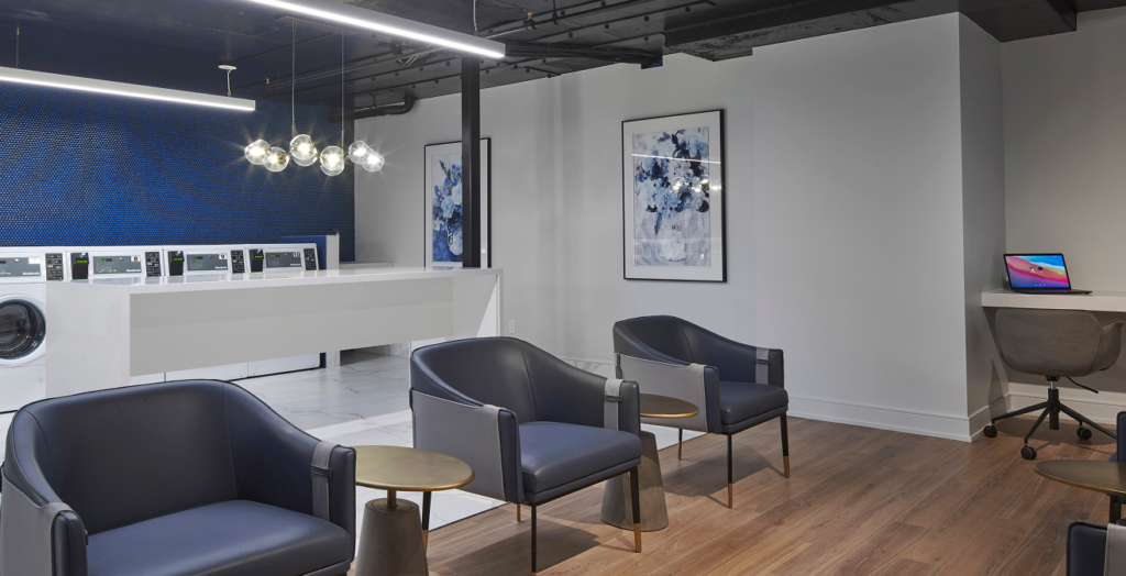 Reimagined lobby lounge at 18 Brownlow featuring sophisticated co-working spaces, designer seating, and modern art in a high-end Midtown setting.