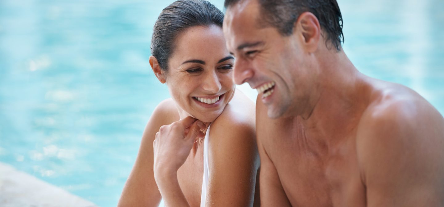 Designer-furnished sun deck and resort-style pool area for residents at 18 Brownlow apartments.
